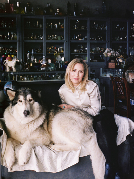 Image may contain Adult Person Face Head Photography Portrait Animal Canine Dog Husky Mammal Pet and Sitting